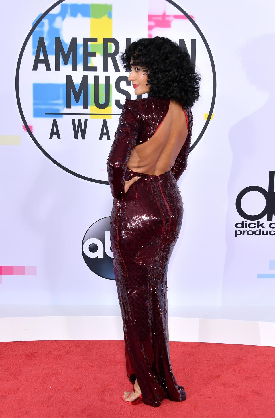 <p>Tracey Ellis Ross, Diana Ross' daughter, is hosting this year's AMAs and looked stunning in a maroon sequinned gown with a cut-out back.</p>