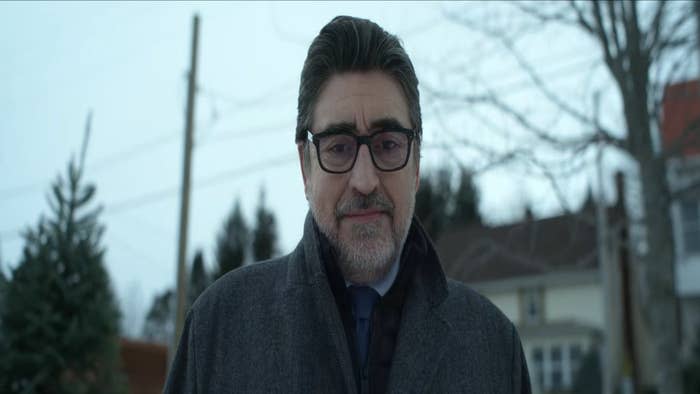 Alfred Molina looks at something