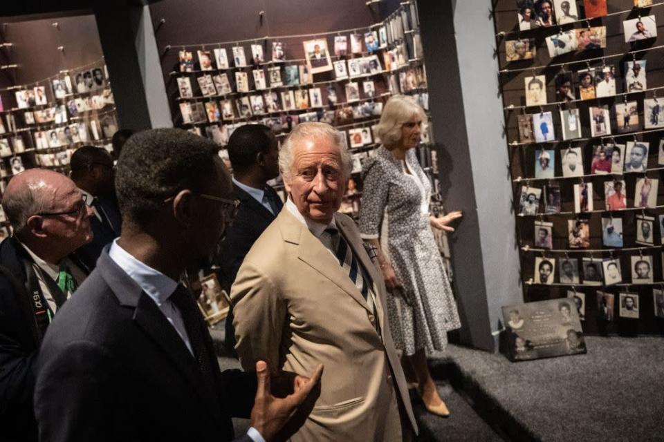 <p>The royal couple toured the Kigali Genocide Memorial together, pictured here with photographs of victims. </p><p>"This memorial is a place of remembrance, a place where survivors and visitors come and pay respect of the victims of genocide against Tutsi," Freddy Mutanguha, the Memorial's director and a survivor himself, told <em><a href="https://www.cnn.com/2022/06/22/africa/prince-charles-genocide-survivors-rwanda-intl/index.html" rel="nofollow noopener" target="_blank" data-ylk="slk:CNN" class="link ">CNN</a></em>. "More than 250,000 victims were buried in this memorial and their bodies were collected in different places ... and this place [has] become a final destination for our beloved ones, our families."</p>