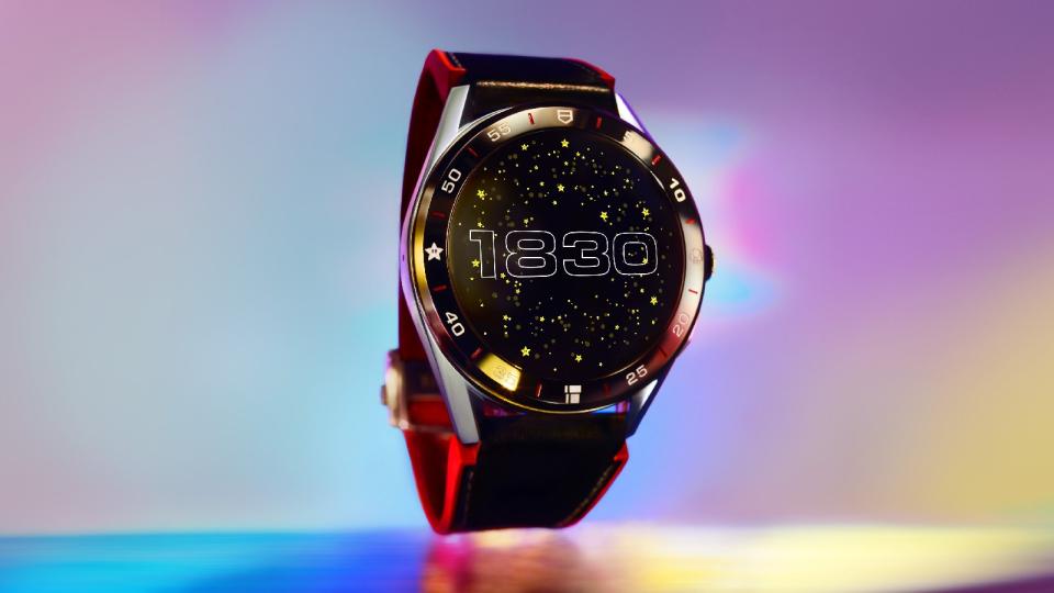 <p>Tag Heuer Connected Limited Edition Super Mario with a red-and-black strap. The watch face features the numbers 1830 in retro font, against a background of stars.</p> 