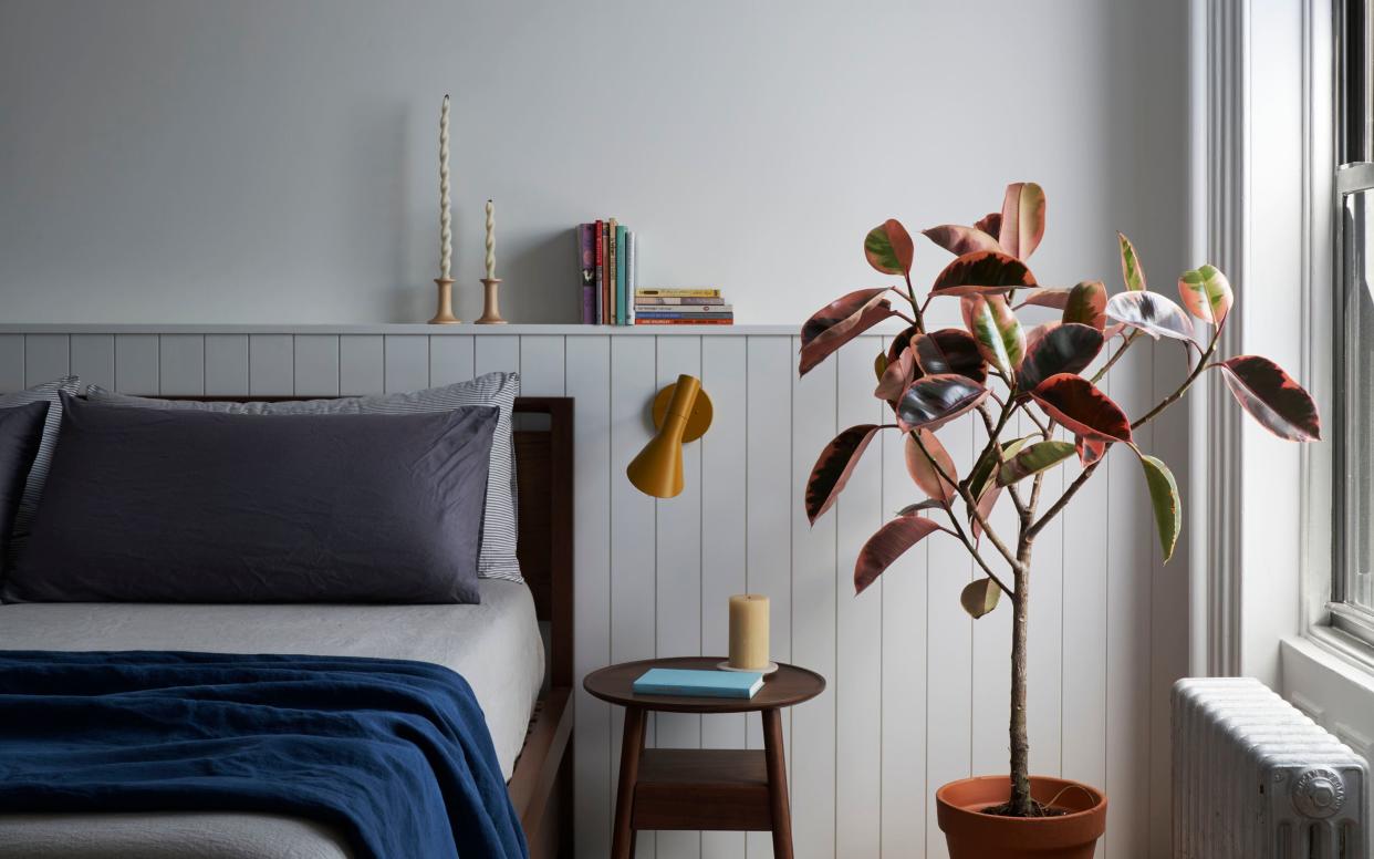  A cozy bedroom with two types of candle and wall light 