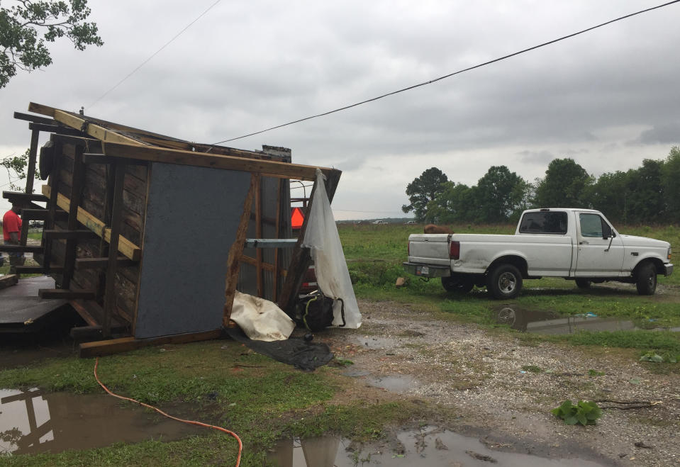 This photo provided by the St. Martin Parish Sheriff's Office shows a building damaged by a tornado that went through Breaux Bridge, La., Sunday, April 2, 2017. The tornado flipped a mobile home Sunday in Louisiana, killing a mother and her daughter as a storm system with hurricane-force winds crawled across the Deep South, damaging homes and businesses. (Maj. Ginny Higgins/St. Martin Parish Sheriff's Office via AP)