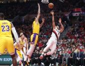 Oct 18, 2018; Portland, OR, USA; Portland Trail Blazers guard CJ McCollum (3) shoots the ball past Los Angeles Lakers forward Kyle Kuzma (0) in the second half at Moda Center. Mandatory Credit: Jaime Valdez-USA TODAY Sports