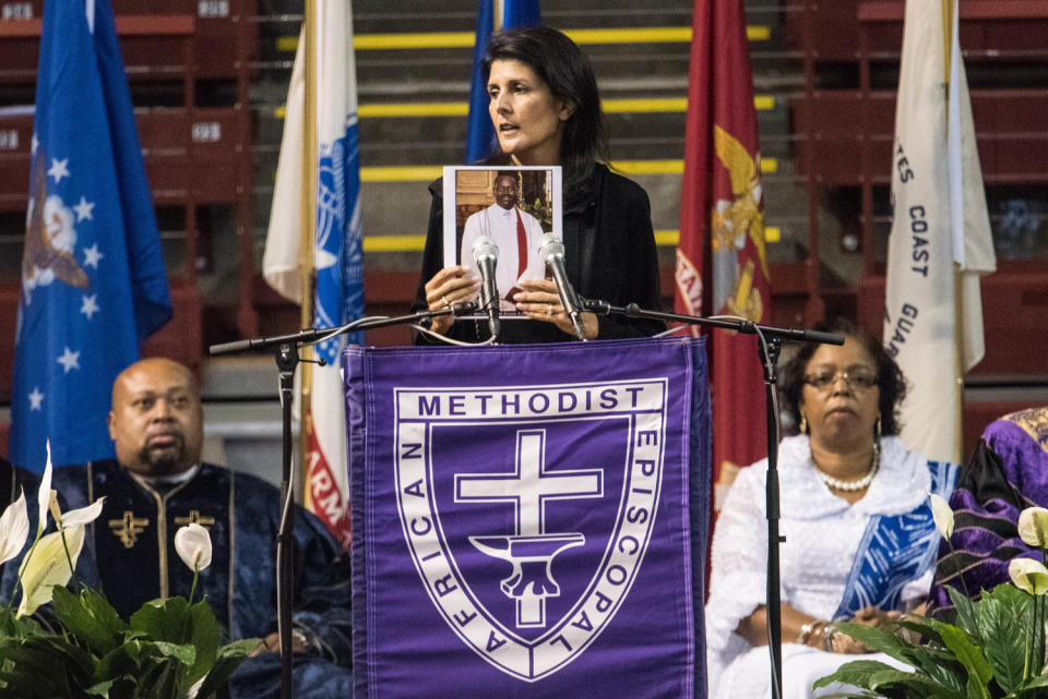 Former South Carolina Governor Nikki Haley holds up a photo of Clementa Pinckney during a memorial service remembering the victims of the mass shooting at Emanuel African Methodist Episcopal (AME) Church on June 17, 2016 in Charleston, S.C.   (Sean Rayford / Getty Images file )