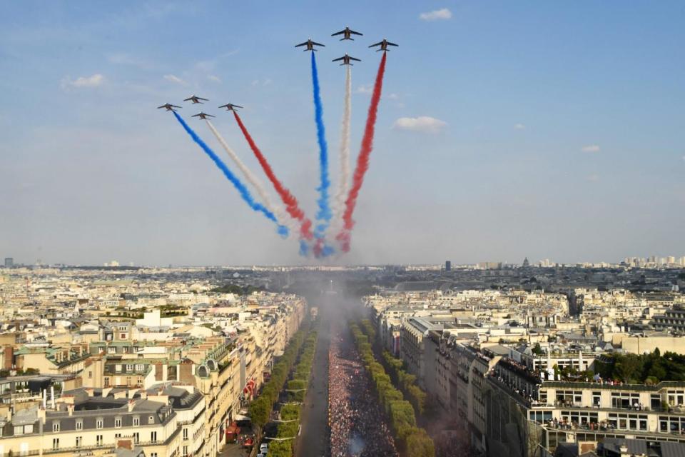 The Patrouille de France jets, trailling smoke in the colours of the French flag (AFP/Getty Images)