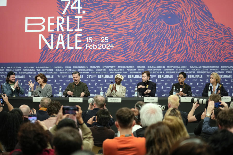 The Film Festival, Berlinale International Jury from left, Brady Corbet, Jasmine Trinca, Christian Petzold, Lupita Nyong'o, Albert Serra, Ann Hui and Oksana Zabuzhko attend a news conference at the opening day of International Film Festival, Berlinale, in Berlin, Thursday, Feb. 15, 2024. The 74th edition of the festival will run until Sunday, Feb. 25, 2024 at the German capital. (AP Photo/Ebrahim Noroozi)