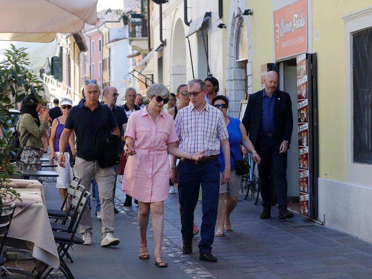 Theresa and Philip May take the air in Lake Garda on Tuesday: perhaps mindful of the fateful decision taken the last time she took a holiday, the PM may be keeping things light this time: Getty