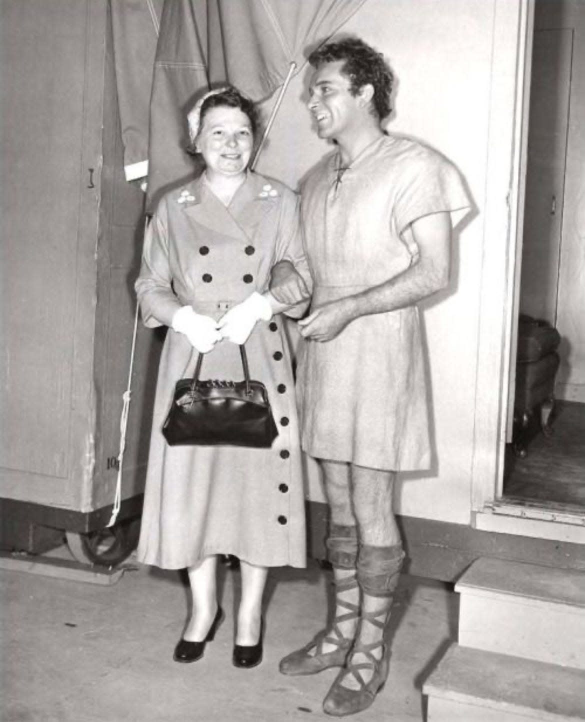 Canton housewife and store clerk Hazel McCann wrote to author and minister Lloyd C. Douglas to inspire his book "The Robe," which later was made into a movie. Here she stands on the set with Richard Burton, the film's star.