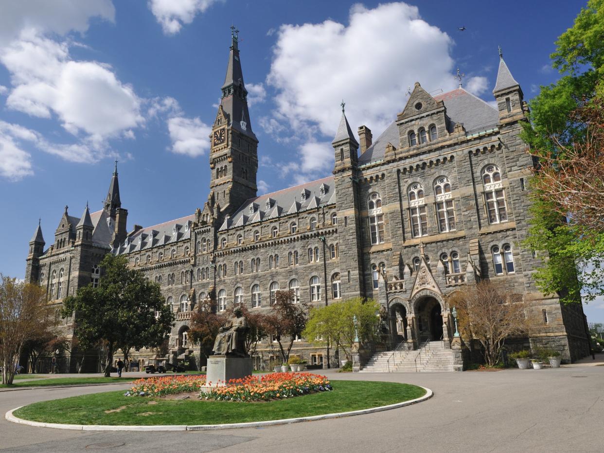 "Washington, D.C., USA - April 9, 2012. Healy Hall with the statue of Georgetown University founder John Carroll in front and some people walking in background. Georgetown University is a top-ranking private university in the United States. It is located in the historic district of Georgetown in Northwest Washington, D.C.": Getty Images