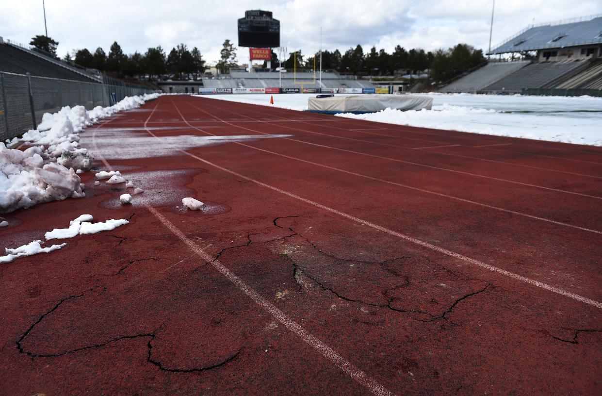 Reno's freezing cold winters have caused cracks, potholes and icy puddles in the university's track, pictured here in 2016. The track was resurfaced later that year and repaired again six years later.