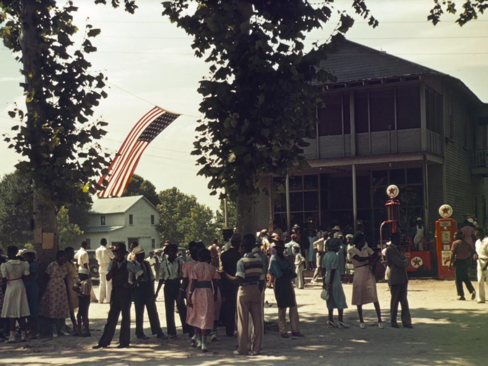 People gather in the street to celebrate July 4 in St Helena Island, South Carolina, in 1939.