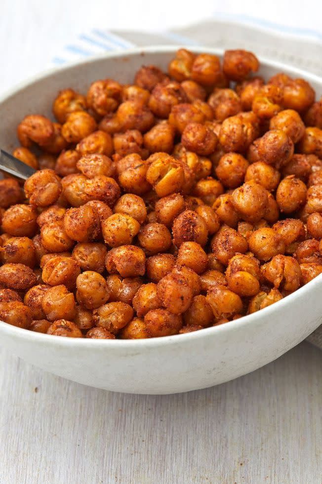 <p>Chickpeas are good for so much more than just <a href="https://www.delish.com/uk/cooking/recipes/a34092710/best-homemade-hummus-recipe/" rel="nofollow noopener" target="_blank" data-ylk="slk:creamy homemade hummus;elm:context_link;itc:0;sec:content-canvas" class="link ">creamy homemade hummus</a>. (Though, that's definitely a good use of them!) They also make for a particularly good salty snack, and are infinitely adaptable based on what you've got in your spice cabinet.</p><p>Get the <a href="https://www.delish.com/uk/cooking/recipes/a34665040/roasted-chickpeas-recipe/" rel="nofollow noopener" target="_blank" data-ylk="slk:Roasted Chickpeas;elm:context_link;itc:0;sec:content-canvas" class="link ">Roasted Chickpeas</a> recipe.</p>