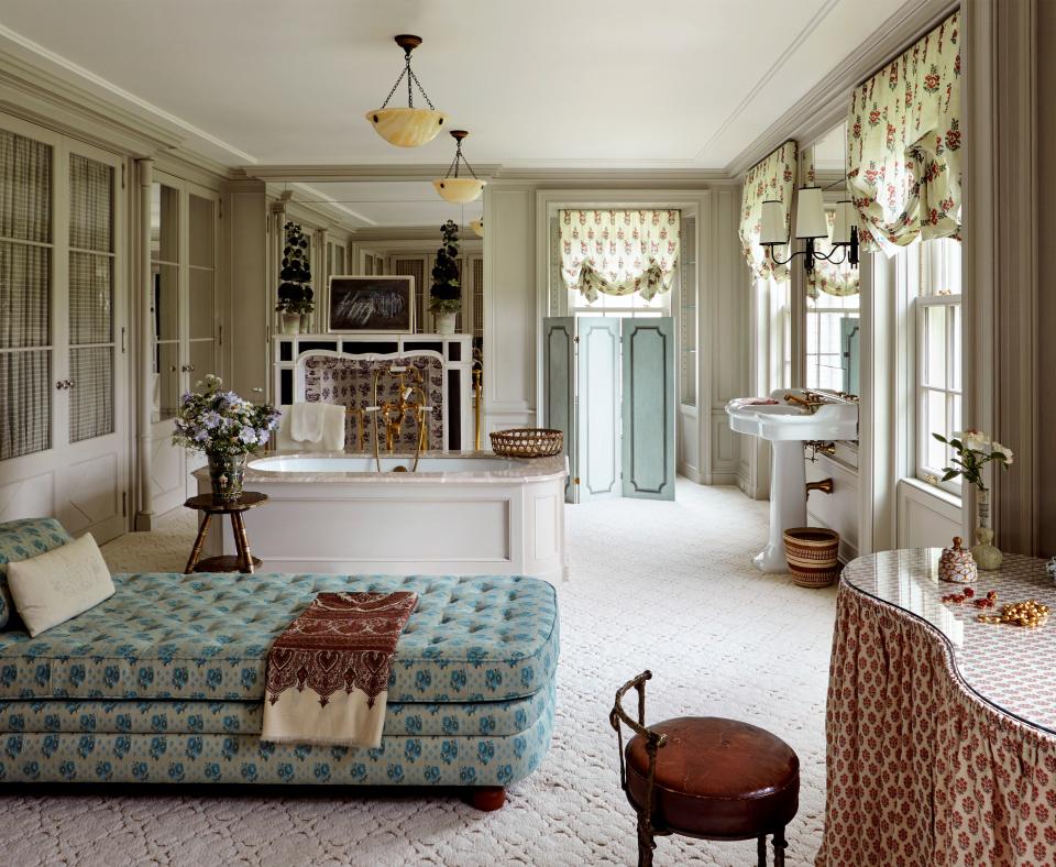 Santo Domingo’s dressing room–bathroom was originally conceived as a suite of three rooms, until an image in the 1970 tome David Hicks on Bathrooms inspired her to combine them into one. Virginia Tupker sourced the Cogolin carpet; the Josef Frank chaise is upholstered in custom Le Manach fabric.