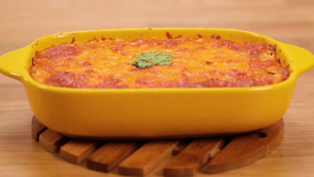 Spicy Saba fish baked rice in a yellow baking tin