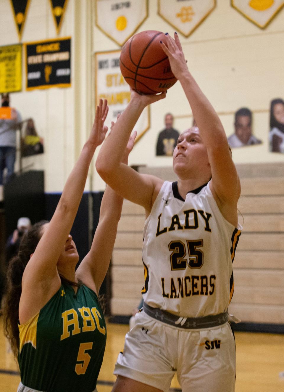 SJV's Katie Hill goes up with shot as RBC Antonia Panayides tries to block her. St John Vianney Girls Basketball smother Red Bank Catholic 61-34 in Championship final in Holmdel, NJ on March 6, 2021.