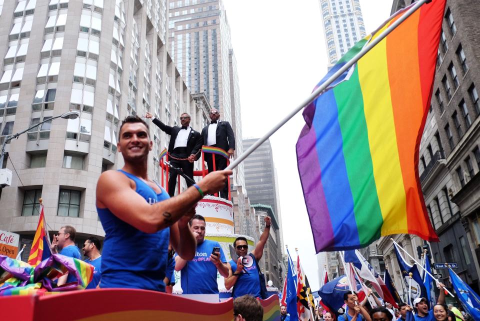 Participants wave rainbow flags during the 2015 New York City Pride march in New York on June 28, 2015.