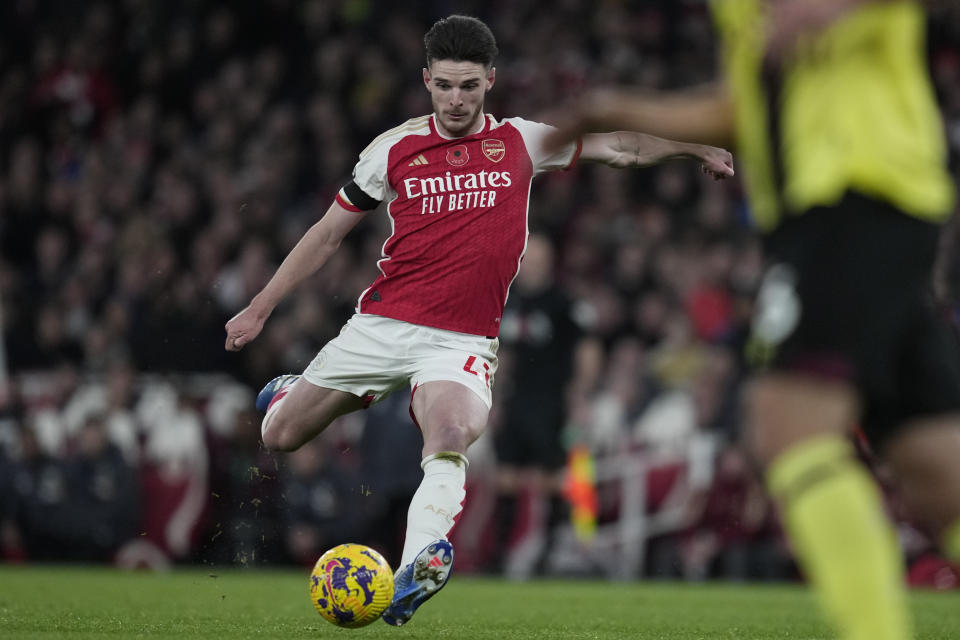 Arsenal's Declan Rice strikes the ball during the English Premier League soccer match between Arsenal and Burnley at Emirates stadium in London, England, Saturday, Nov. 11, 2023. (AP Photo/Kin Cheung)