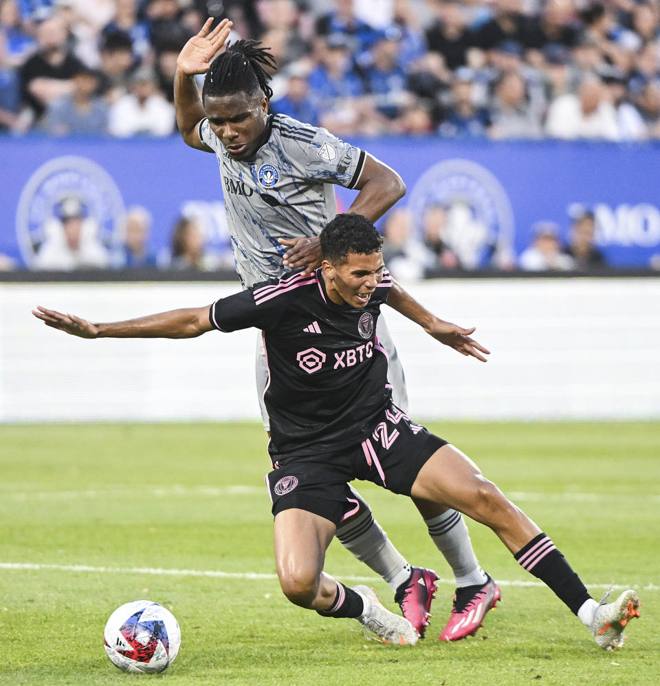 CF Montreal's Chinonso Offor, top, challenges Inter Miami's Ian Fray (24) during first-half MLS soccer match action in Montreal, Saturday, May 27, 2023. (Graham Hughes/The Canadian Press via AP)