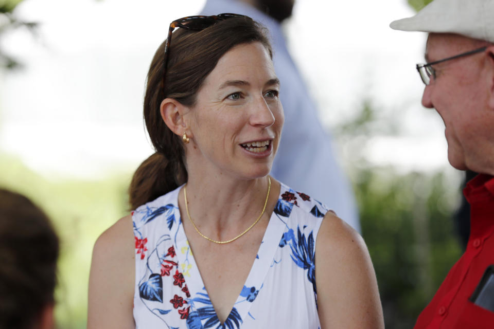 Amy O'Rourke talks with a local resident while touring the Coyote Run Farm with her husband Democratic presidential candidate Beto O'Rourke, Friday, June 7, 2019, in Lacona, Iowa. (AP Photo/Charlie Neibergall)