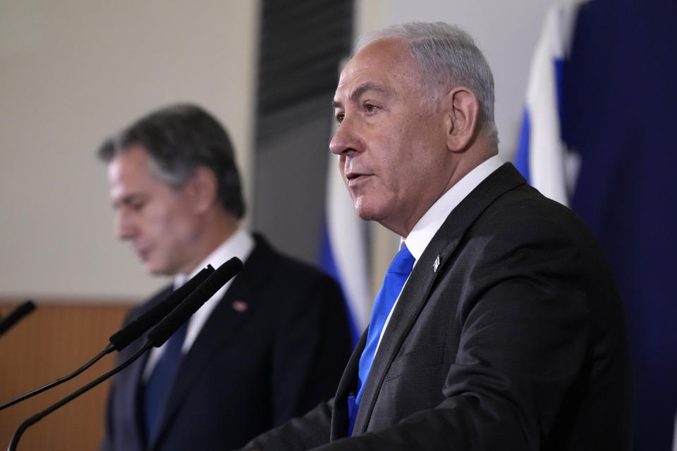 Israel's Prime Minister Benjamin Netanyahu make statements with the U.S. Secretary of State Antony Blinken to the media, inside The Kirya, which houses the Israeli Ministry of Defense, after their meeting in Tel Aviv, Thursday Oct. 12, 2023. President Joe Biden is dispatching his top diplomat to Israel on an urgent mission to show U.S. support after the unprecedented attack by Hamas militants. (AP Photo/Jacquelyn Martin, pool)