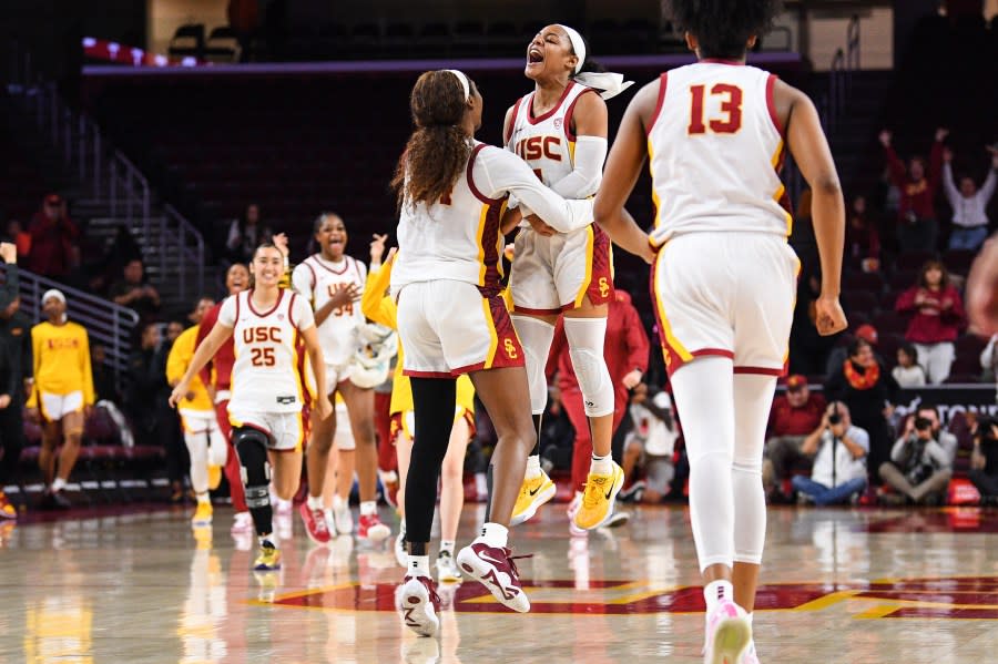 LOS ANGELES, CA – JANUARY 15: USC Trojans guard Okako Adika (24) and Kayla Williams (4) celebrates after winning the women’s college basketball game between the Stanford Cardinal and the USC Trojans on January 15, 2023 at Galen Center in Los Angeles, CA. (Photo by Brian Rothmuller/Icon Sportswire via Getty Images)