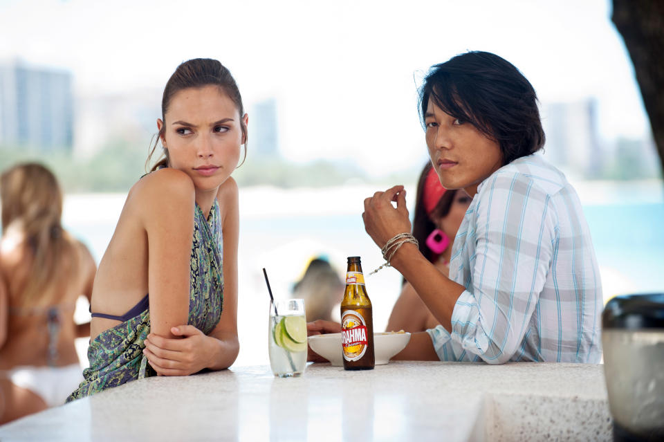 Gisele (Gadot) and Han (Sung Kang) in Fast Five. (Photo: Jaimie Trueblood/Universal Pictures/Courtesy Everett Collection)