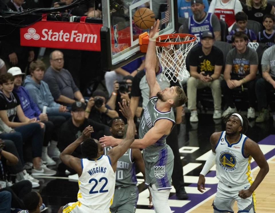 Sacramento Kings center Domantas Sabonis (10) blocks shot by Golden State Warriors forward Andrew Wiggins (22) during Game 5 of the first-round NBA playoff series at Golden 1 Center on Wednesday.