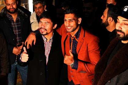 Manny Pacquiao and Amir Khan pose on Friday after holding discussions about the possibility of a future fight. (Photo by Dan Istitene/Getty Images)