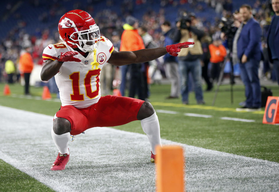 FILE - In this Sunday, Oct. 14, 2018, file photo, Kansas City Chiefs wide receiver Tyreek Hill strikes a pose as he warms up before an NFL football game against the New England Patriots in Foxborough, Mass. It's been a while since the NFL flexed a game to Sunday night. The Bengals vs. Chiefs is a worthy choice, (AP Photo/Michael Dwyer, File)