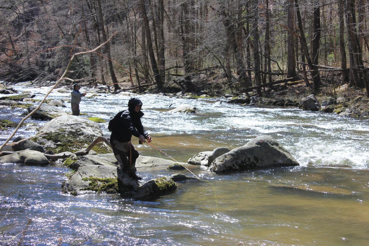 Rob Wildfer and Jim O'Neil fly fish in the Rocky Broad River in Bat Cave.