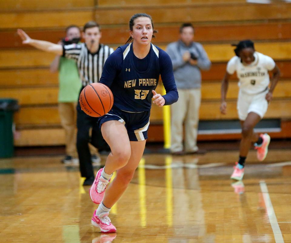 New Prairie senior Morgan White dribbles the ball up the court during a girls basketball game against South Bend Washington Thursday, Nov. 30, 2023, at Washington High School in South Bend.