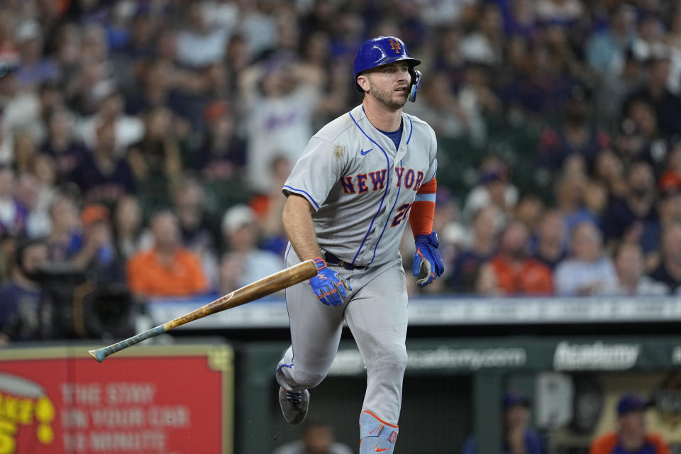 New York Mets' Pete Alonso watches his sacrifice fly against the Houston Astros during the sixth inning of a baseball game Wednesday, June 22, 2022, in Houston. (AP Photo/David J. Phillip)