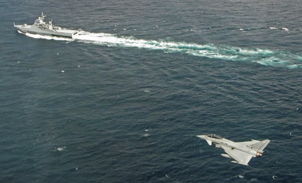 An RAF Typhoon overflies the Russian Navy Project 22160 patrol ship <em>Vasily Bykov</em> over the North Sea. <em>Crown Copyright</em>