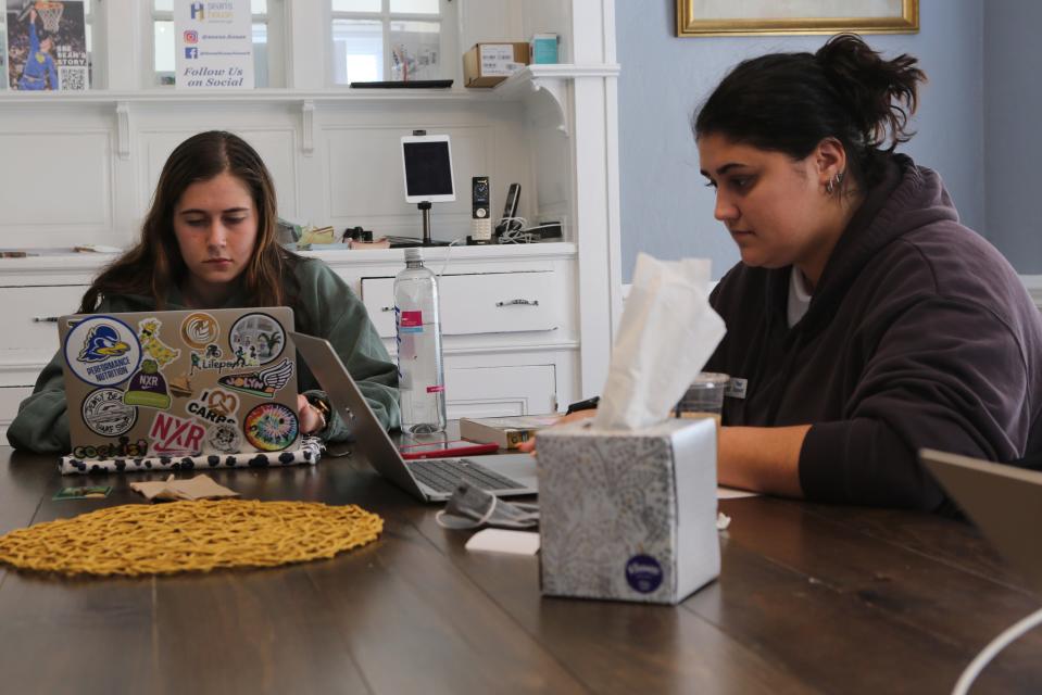 Jordan Ormsby (left) and Liz Colao (right) study at Sean's House in Newark.