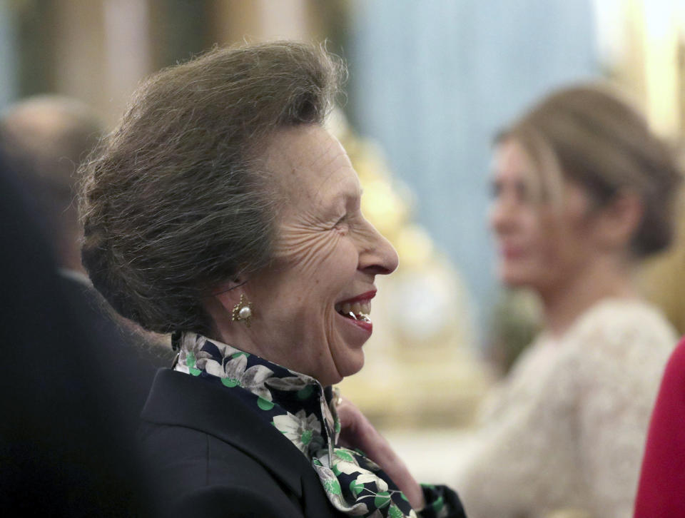 FILE - In this Tuesday, Dec. 3, 2019 file photo, Britain's Princess Anne talks to guests during a reception at Buckingham Palace, as NATO leaders gather to mark 70 years of the alliance, in London. The British royal family might be known for smiling and waving in fancy outfits, but they work just as hard as anyone else…right? According to official records, prominent members of the royal family worked on average 84.5 days, a third of the 253 working days in 2019. The Queen’s only daughter, Princess Anne, was the hardest working royal for the second year in a row, working a total of 167 days. (Yui Mok/Pool Photo via AP, File)