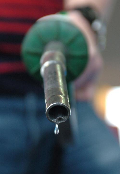 A person using a petrol pump