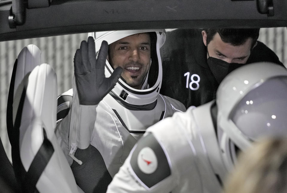 United Arab Emirates astronaut Sultan al-Neyadi waves from the backseat of a car after leaving the Operations and Checkout building for a trip to Launch Pad 39-A Wednesday, March 1, 2023, at the Kennedy Space Center in Cape Canaveral, Fla. Al-Neyadi is among four astronauts scheduled to liftoff early Thursday morning on a trip to the International Space Station. (AP Photo/John Raoux)