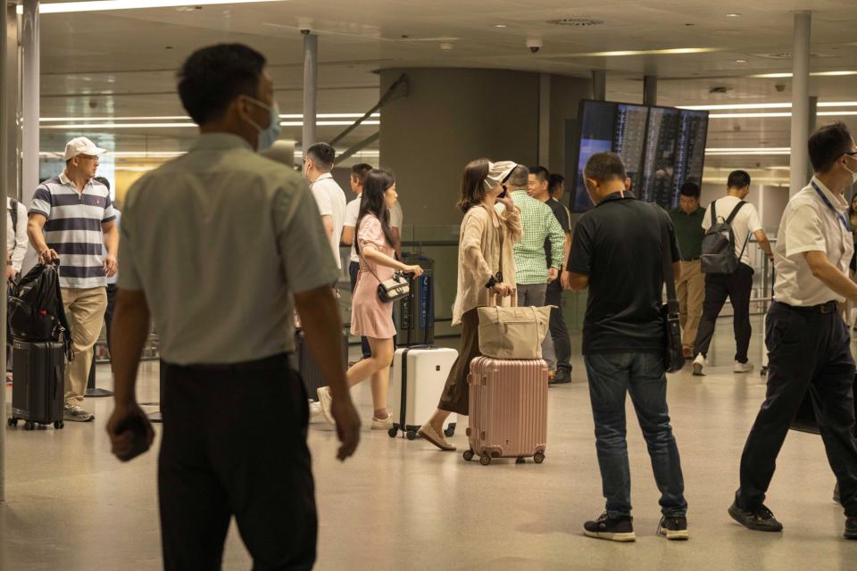 Travelers in the arrival hall at Hongqiao International Airport in Shanghai, China, on Tuesday, July 11, 2023. The summer holiday season started with a bang for China's aviation sector, with passenger traffic at the country's airports reaching almost 9 million -- about the population of Switzerland -- in the first five days of July.