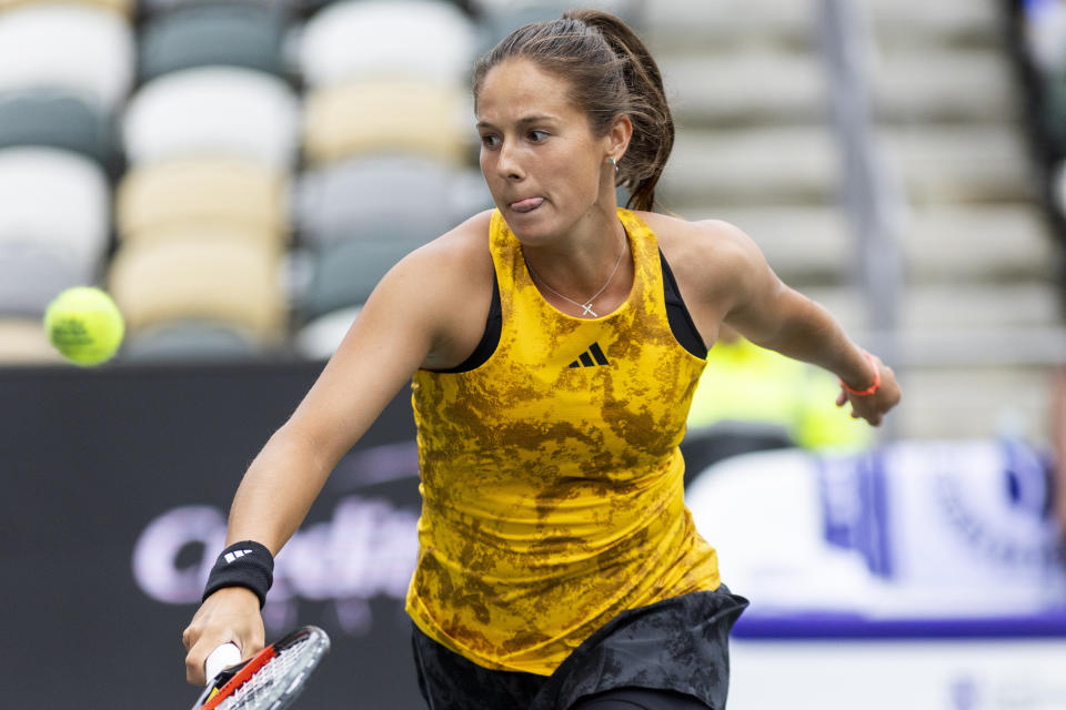 Daria Kasatkina, of Russia, returns a shot to Ons Jabeur, of Tunisia, during a semifinal game at the Charleston Open tennis tournament in Charleston, S.C., Saturday, April 8, 2023. (AP Photo/Mic Smith)