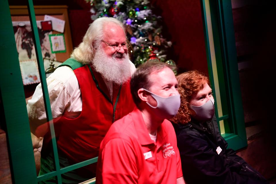 Santa has his own Smoky Mountain cabin at Dollywood, and visitors might catch him working on his holiday lists.