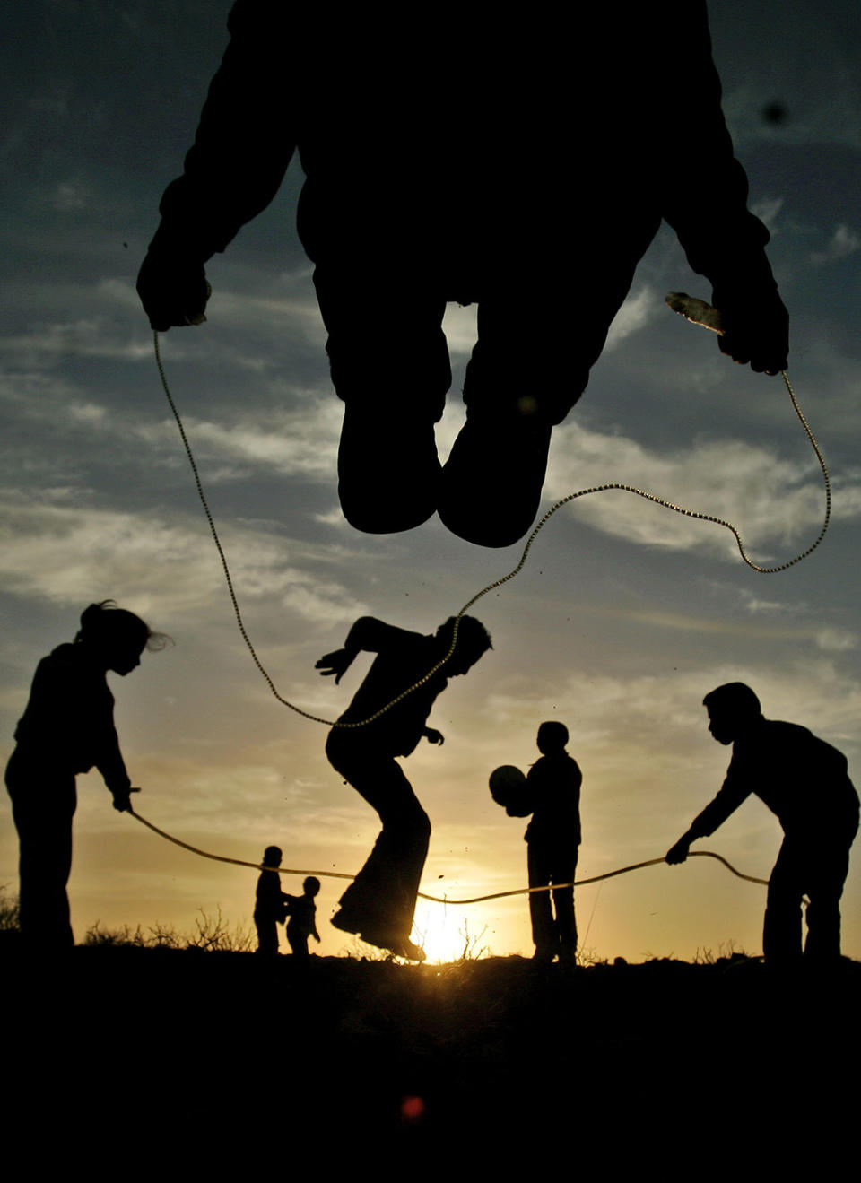 <p>Palestinian youths and children play during sunset in the West Bank city of Ramallah, Feb. 9, 2008. (Photo: Muhammed Muheisen/AP) </p>