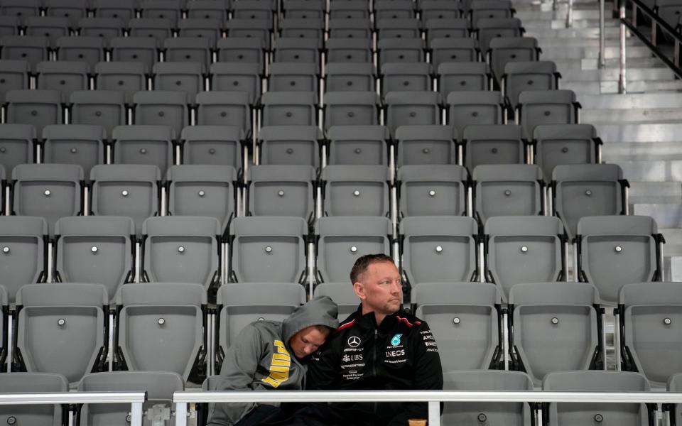 Fans wait around during a delay before the second practice session for the Formula One Las Vegas Grand Prix auto race, Thursday, Nov. 16, 2023