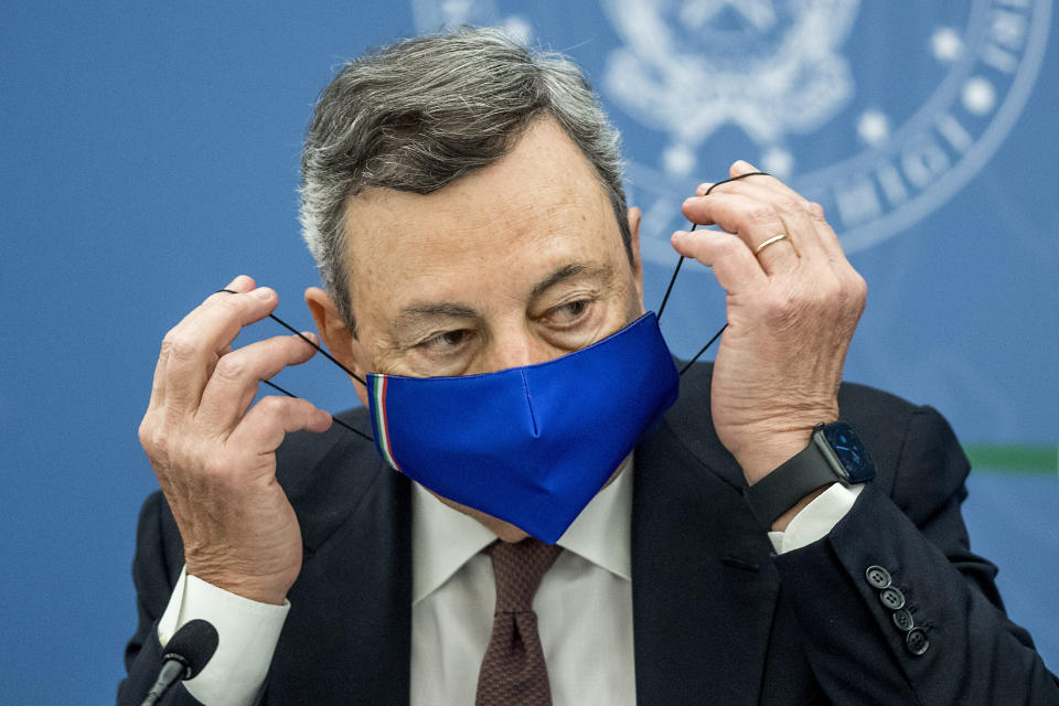 Italian Premier Mario Draghi attends a press conference at Chigi Palace government office in Rome, Thursday, July 22, 2021. With COVID-19 cases rising again, Italy will start requiring people to have a so-called “green pass” to access venues like gyms, museums and indoor restaurants. Certification that one is vaccinated, has recovered from COVID-19 in the last six months or tested negative in the previous 48 hours will let people dine at indoor restaurants, go to movies, sports events, casinos and other indoor recreational venues. (Roberto Monaldo/LaPresse via AP)