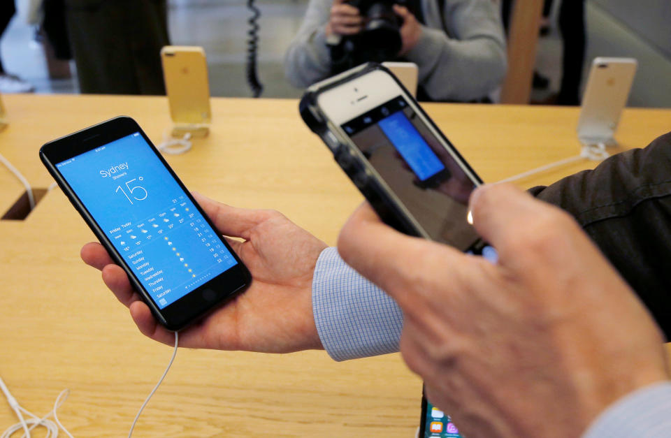 A man takes a picture of new iPhone 7 with another iPhone as the iPhone 7 goes on sale for the first time at Australia's flagship Apple store in Sydney, September 16, 2016. REUTERS/Jason Reed