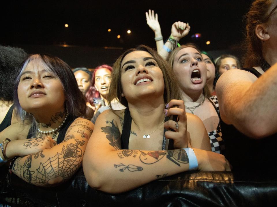 Festival goers attend Official Lollapalooza Aftershow, watching performance by Max.