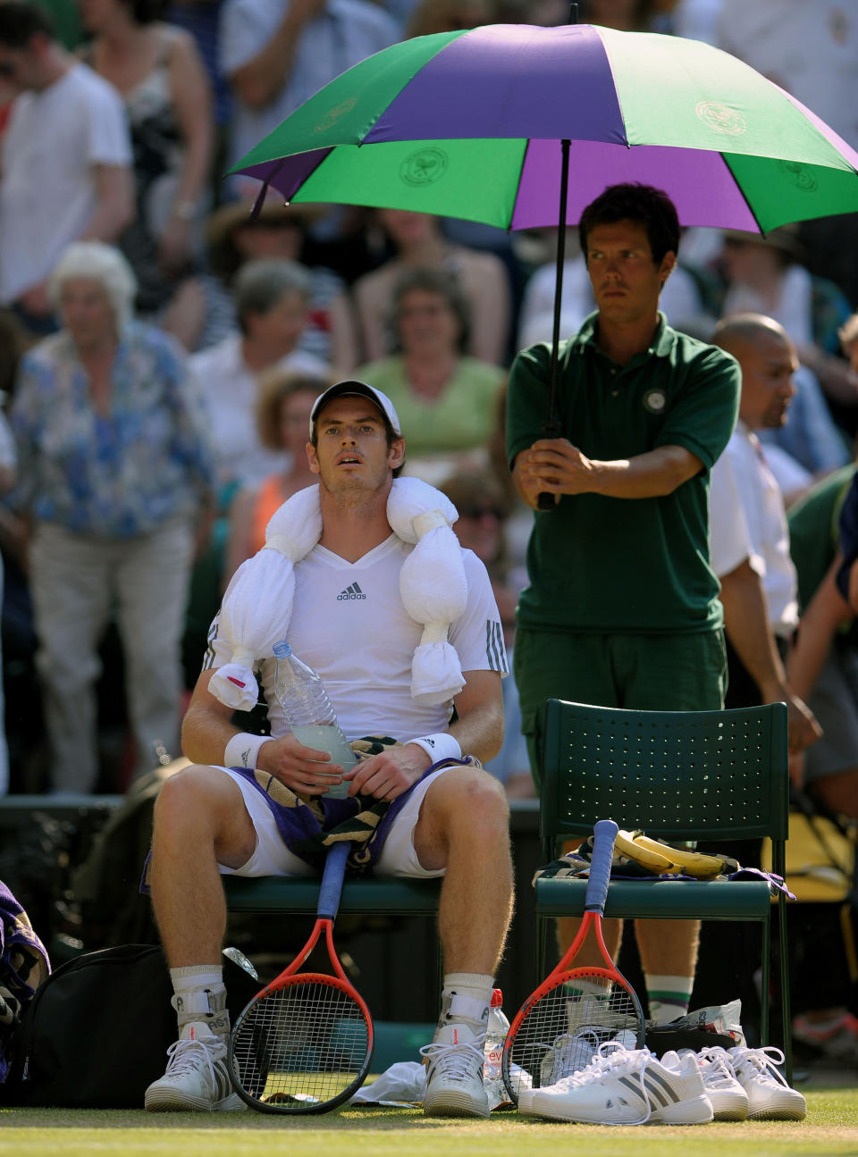 Great Britain's Andy Murray sits with a towel of ice on his head during a break of ends in his match against Serbia's Novak Djokovic on day thirteen of the Wimbledon Championships at The All England Lawn Tennis and Croquet Club, Wimbledon.