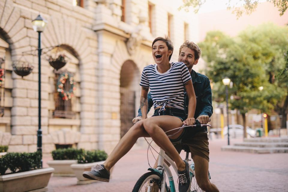 Man and woman cycling on vacation