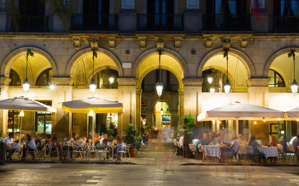 People dining outside at night.