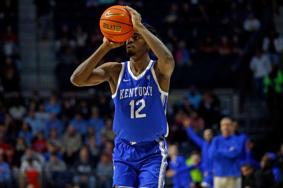 Jan 31, 2023; Oxford, Mississippi, USA; Kentucky Wildcats guard Antonio Reeves (12) attempts a three-point shot during the first half against the Mississippi Rebels at The Sandy and John Black Pavilion at Ole Miss. Mandatory Credit: Petre Thomas-USA TODAY Sports