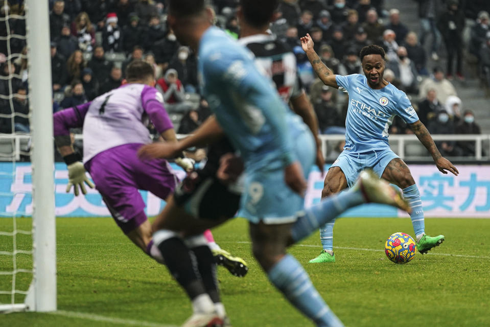 Manchester City's Raheem Sterling scores his side's fourth goal, during the English Premier League soccer match between Newcastle and Manchester City at St. James' Park, Newcastle, England, Sunday, Dec. 19, 2021. (Owen Humphreys/PA via AP)